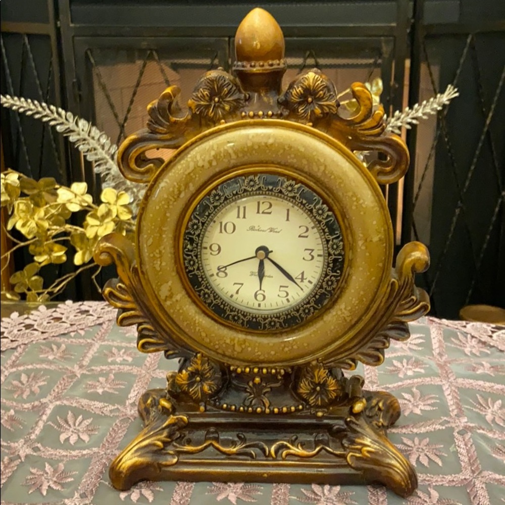 Set of gold candle stand and clock.